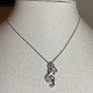 Silvertone Musical notes G clef necklace with rhinestones